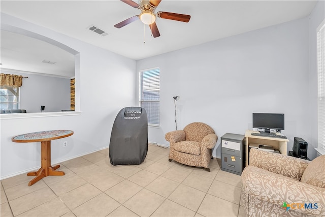 sitting room with light tile patterned floors and ceiling fan