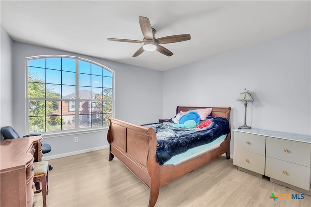 bedroom with ceiling fan and light wood-type flooring