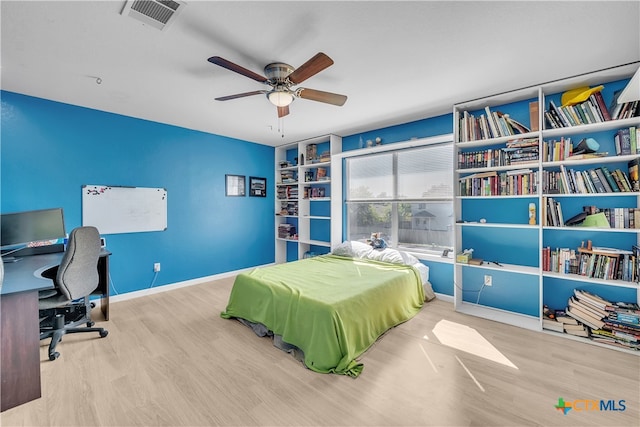 bedroom with ceiling fan and light hardwood / wood-style floors