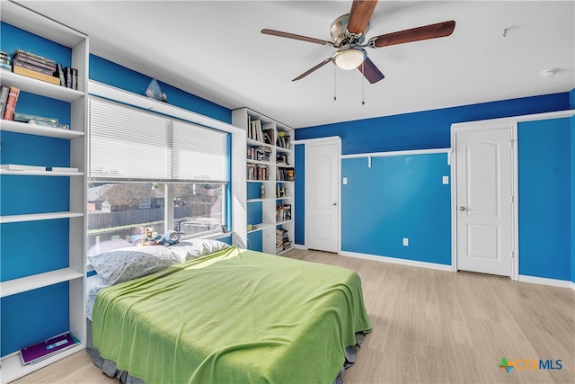 bedroom featuring light wood-type flooring and ceiling fan