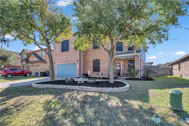 view of front of house with a front yard and a garage