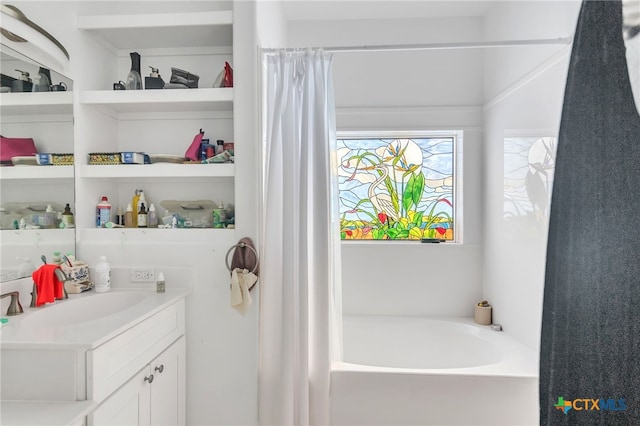 bathroom featuring vanity and a bathing tub