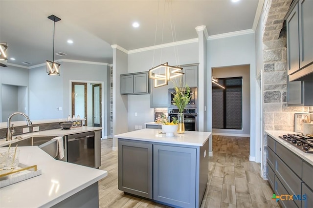 809 Reston Rd, Temple, TX 76502 - kitchen with appliances with stainless steel finishes, gray cabinetry, a kitchen island, crown molding, and a sink