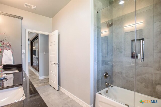 809 Reston Rd, Temple, TX 76502 - bathroom with enclosed tub / shower combo and baseboards