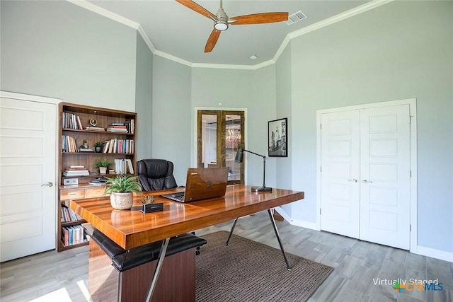 809 Reston Rd, Temple, TX 76502 - office with ornamental molding, a ceiling fan, light wood-type flooring, baseboards, and a high ceiling