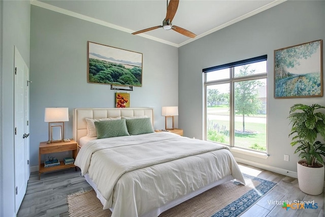 809 Reston Rd, Temple, TX 76502 - bedroom featuring wood finished floors, crown molding, baseboards, and ceiling fan