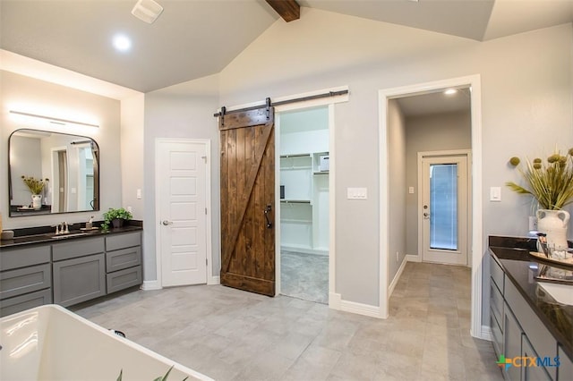 809 Reston Rd, Temple, TX 76502 - full bath with vanity, a freestanding tub, a spacious closet, recessed lighting, and baseboards