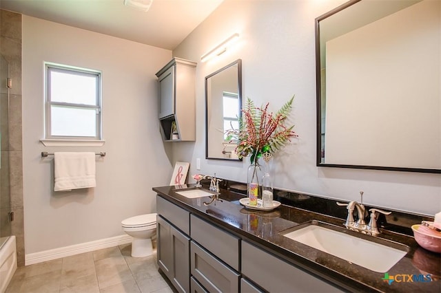 809 Reston Rd, Temple, TX 76502 - bathroom with double vanity, toilet, baseboards, tile patterned floors, and bath / shower combo with glass door