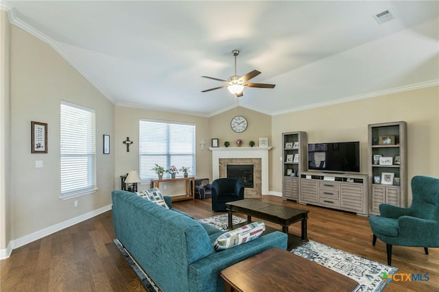 living room with lofted ceiling, dark wood-type flooring, a fireplace, and ornamental molding