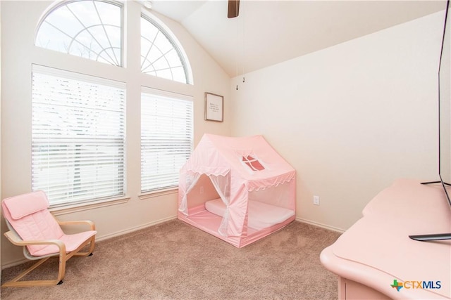 playroom with lofted ceiling, carpet, and a ceiling fan