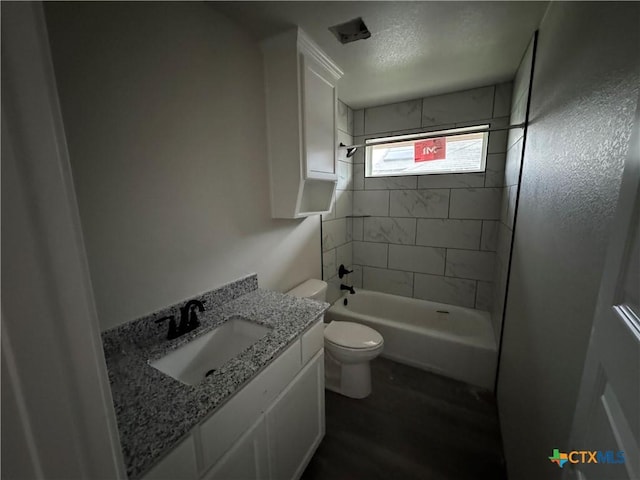 149 Atlas Ave, Killeen, TX 76542 - bathroom with toilet, shower / bath combination, vanity, a textured ceiling, and wood finished floors