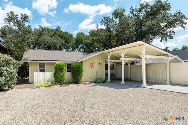 single story home with a carport