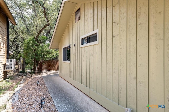 view of property exterior with central AC