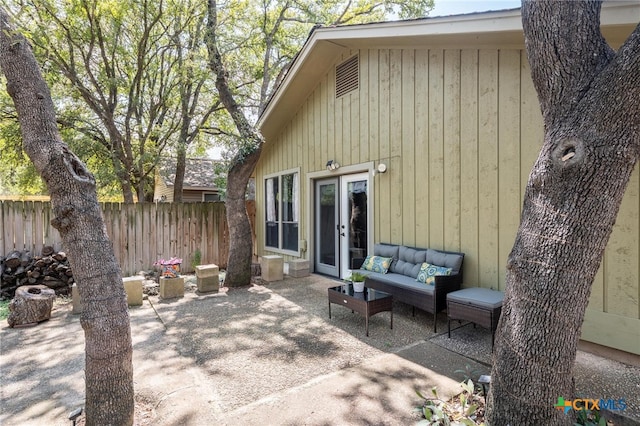 view of patio / terrace with french doors and an outdoor living space