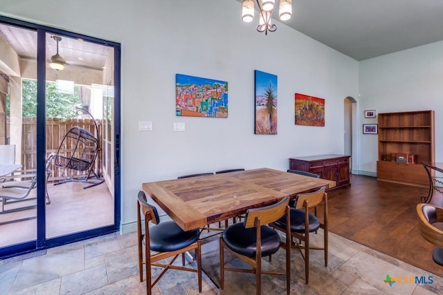1215 Gruene Vintage, New Braunfels, TX 78130 - dining room featuring arched walkways, stone finish floors, and baseboards