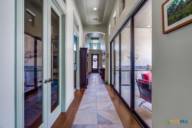 1215 Gruene Vintage, New Braunfels, TX 78130 - hall featuring french doors, arched walkways, and wood finished floors