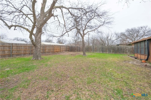 view of yard featuring a fenced backyard