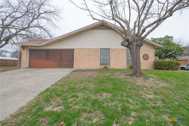 single story home with a garage, a front lawn, concrete driveway, and brick siding