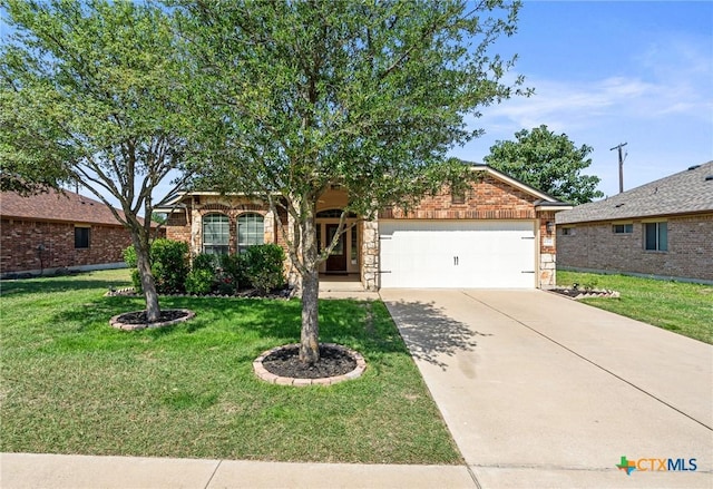 6902 Golden Oak Ln, Killeen, TX 76542 - view of front of property with an attached garage, driveway, a front yard, brick siding, and stone siding