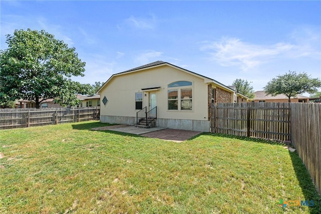 6902 Golden Oak Ln, Killeen, TX 76542 - rear view of house featuring entry steps and a patio