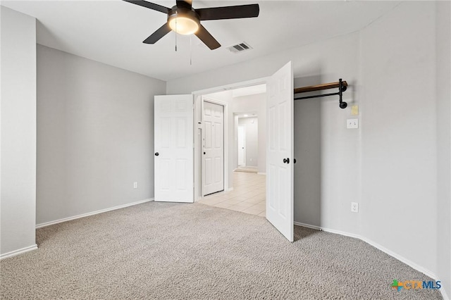 6902 Golden Oak Ln, Killeen, TX 76542 - unfurnished bedroom with light carpet, baseboards, and ceiling fan