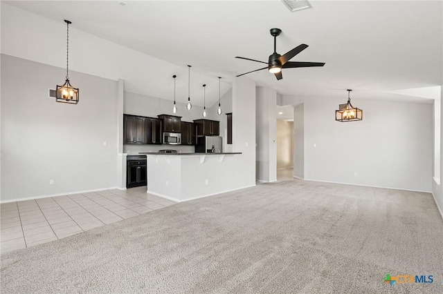6902 Golden Oak Ln, Killeen, TX 76542 - unfurnished living room featuring vaulted ceiling, light carpet, light tile patterned flooring, a ceiling fan, and baseboards