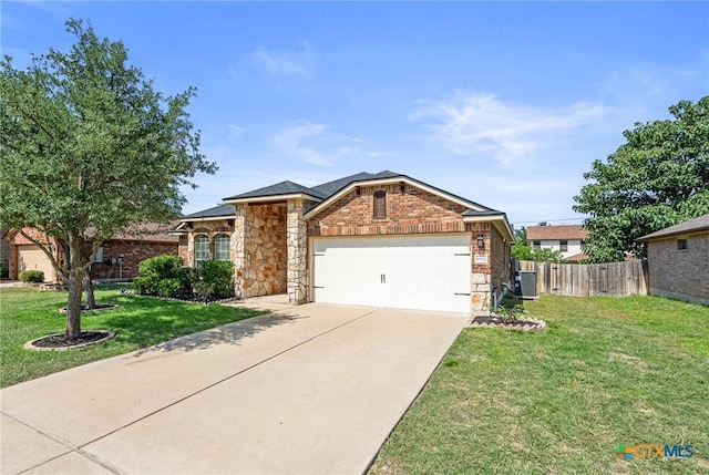 6902 Golden Oak Ln, Killeen, TX 76542 - single story home featuring a garage, cooling unit, stone siding, and concrete driveway