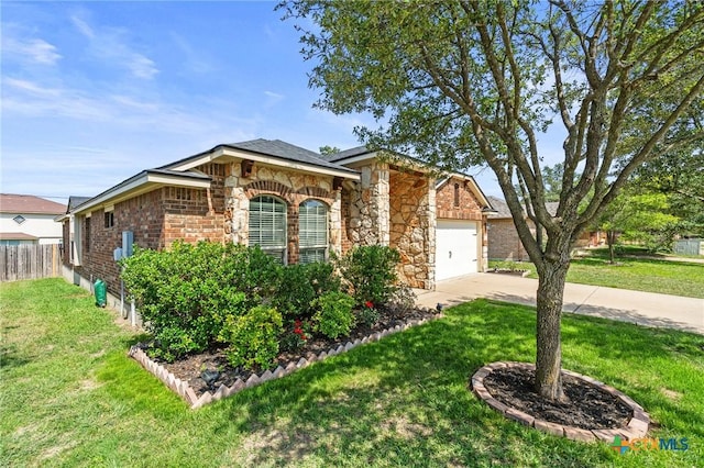 6902 Golden Oak Ln, Killeen, TX 76542 - view of front of house featuring driveway, a garage, stone siding, and brick siding