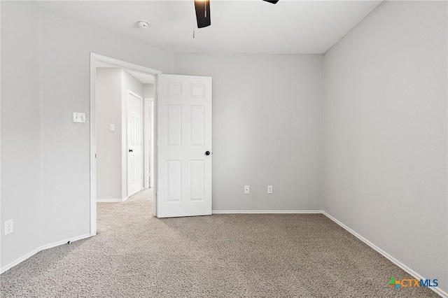 6902 Golden Oak Ln, Killeen, TX 76542 - empty room featuring a ceiling fan, carpet floors, baseboards, and a smoke detector