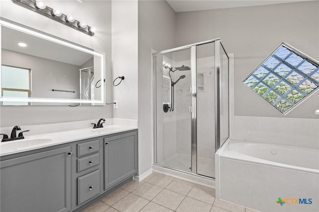 6902 Golden Oak Ln, Killeen, TX 76542 - full bath featuring tile patterned flooring, a stall shower, a garden tub, and double vanity