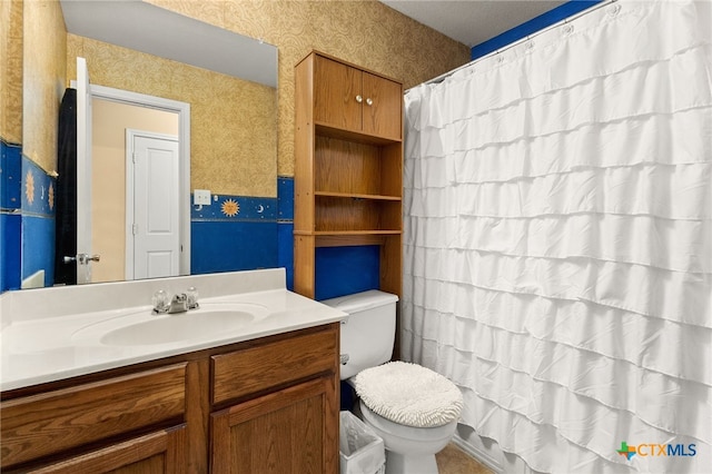 3628 Tilden Trl, New Braunfels, TX 78132 - bathroom featuring wallpapered walls, toilet, vanity, and curtained shower