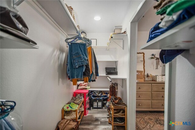 807 W Dallas Ave, Seadrift, TX 77983 - walk in closet featuring wood finished floors