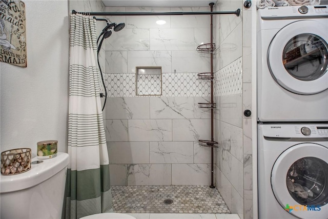 807 W Dallas Ave, Seadrift, TX 77983 - full bathroom with toilet, stacked washer and dryer, and a tile shower