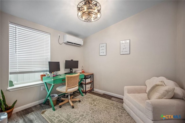 807 W Dallas Ave, Seadrift, TX 77983 - home office featuring wood finished floors, baseboards, and an AC wall unit
