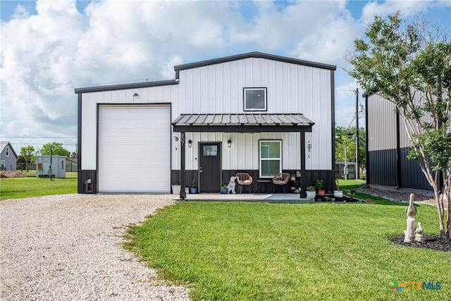 807 W Dallas Ave, Seadrift, TX 77983 - modern farmhouse with board and batten siding, driveway, a front yard, and metal roof
