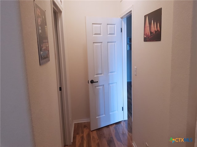 hall with dark hardwood / wood-style floors