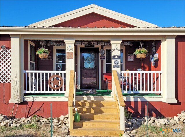 property entrance featuring covered porch