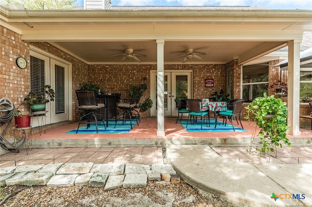 view of patio with french doors and ceiling fan