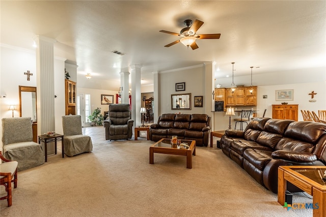 living room featuring ornamental molding, ceiling fan, light colored carpet, and ornate columns