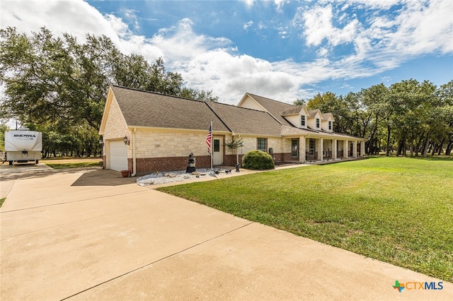 new england style home with a garage and a front yard