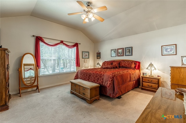 bedroom featuring ceiling fan, lofted ceiling, and light colored carpet