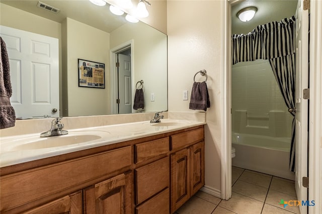 full bathroom featuring vanity, tile patterned flooring, toilet, and shower / bathing tub combination