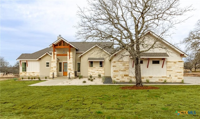 rear view of property with a yard and a patio