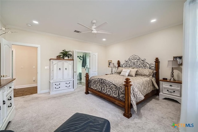 bedroom featuring crown molding, light colored carpet, connected bathroom, and ceiling fan