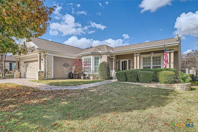 ranch-style house with a garage and a front yard