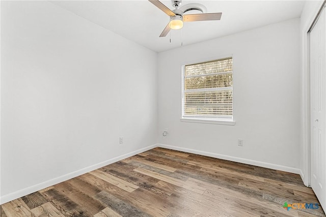 unfurnished room with ceiling fan and wood-type flooring