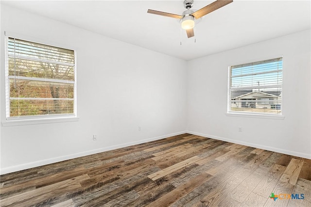 spare room with ceiling fan and hardwood / wood-style floors