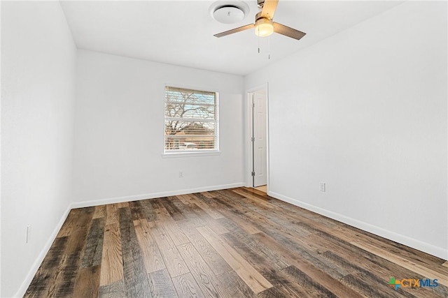 empty room featuring hardwood / wood-style flooring and ceiling fan