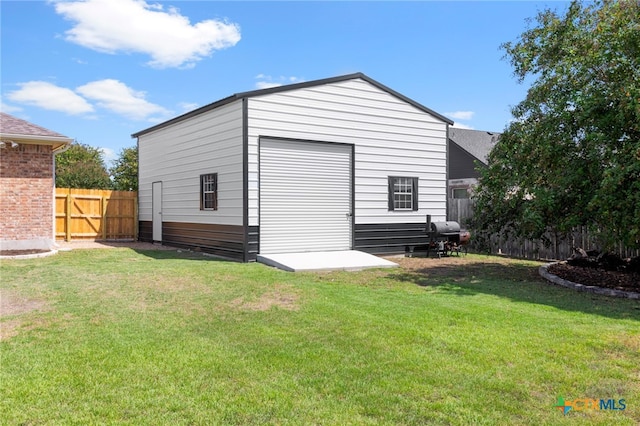 view of outbuilding with a lawn