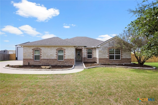 ranch-style house with a garage and a front lawn